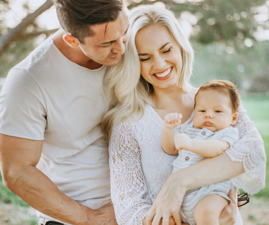 Father caring for newborn baby at home, representing parental leave entitlements for primary carers in Australia