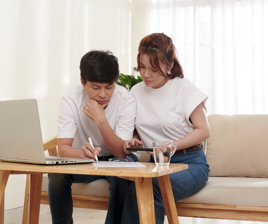 Conveyancing solicitor in NSW reviewing a contract with home buyers before settlement.”